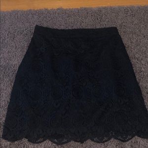A navy blue 00 zip up skirt, from Hollister